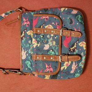 Canvas crossbody bag with bird design.